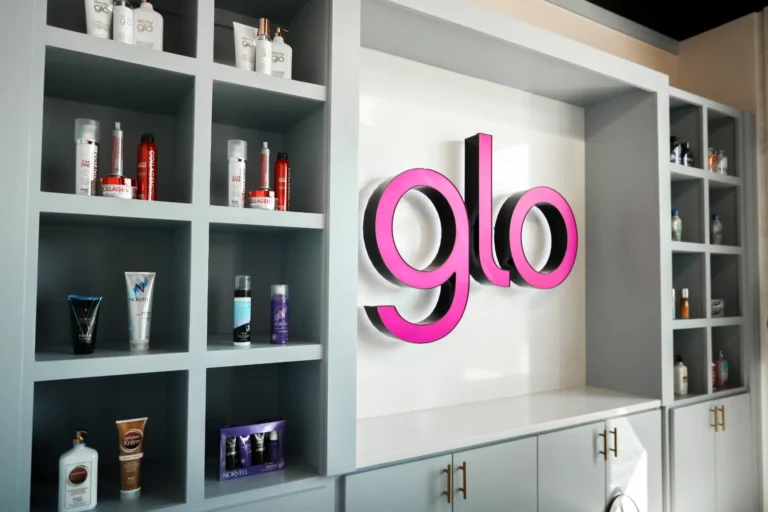 Shelves with tanning products at a Glo Tanning front desk.